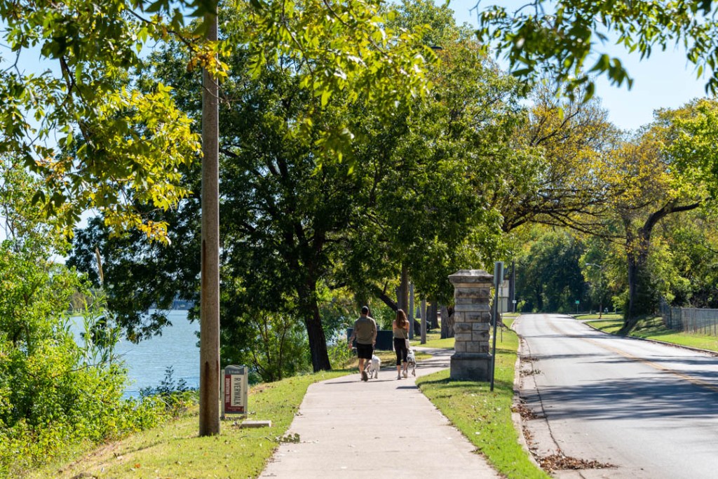 Man and woman and their two dogs walking along Waco's Riverwalk. ©Jeri Murphy Photography