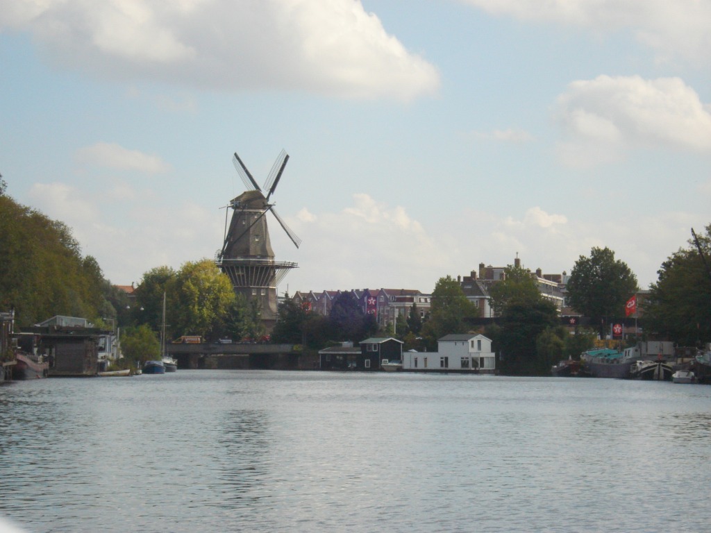 Windmill along banks of an Amsterdam canal.
